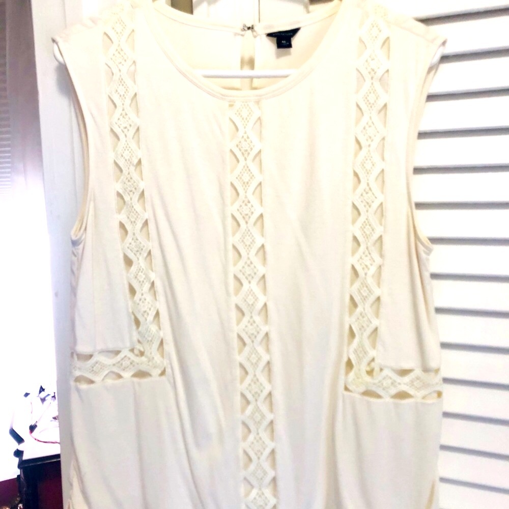 Cream colored Ann Taylor blouse with cut outs